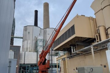 Bill Boom boom truck setting a condenser for a server room at the Xcel Energy power plant in Boulder, Colorado
